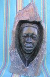 Shona Black Serpentine "Woman in Rock" Sculpture